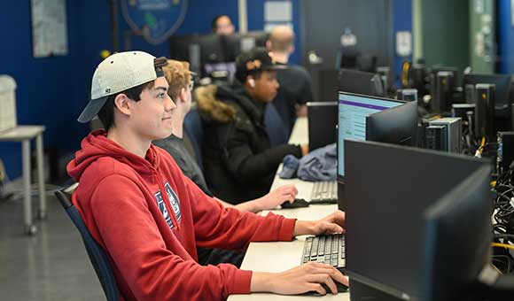 Jacob Harding works on a project in the Cybersecurity lab.