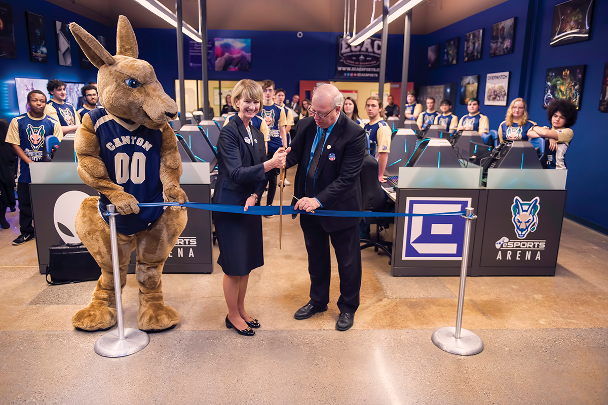 The Chancellor helps President Szafran and Roody cut the ribbon at the eSports Grand Opening.