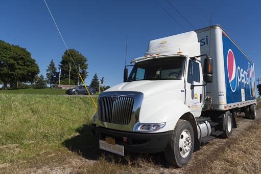 The college's commercial truck parked in a cornfield outside of campus.