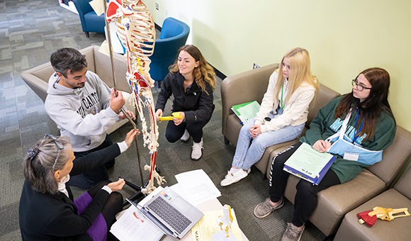 High school students participating in a dual enrollment science course.