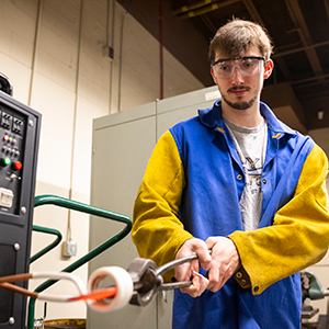 Mitch Timerman heats up his steel in the college’s new induction forge.