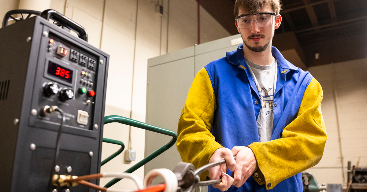 Mitch Timerman heats up his steel in the college’s new induction forge.