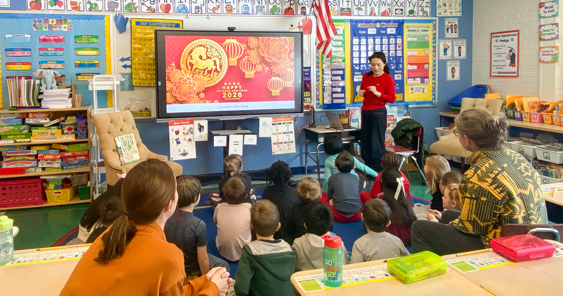 Visiting Assistant Professor Alice Jiang presents to an elementary class about the Chinese New Year.