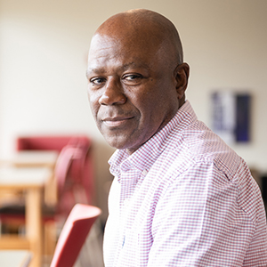 Phillip James works on a laptop in Southworth Library.