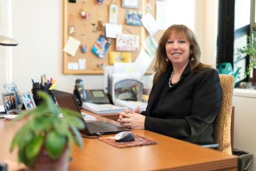 Vice President for Advancement Tracey Thompson sits at her desk in French Hall