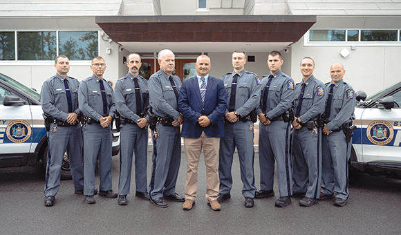 University Police stand in front of the Dana Hall entrance.