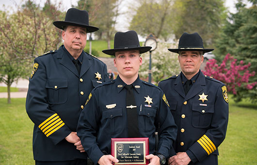 St. Lawrence County Sheriff, a new deputy, and Undersheriff stand together 