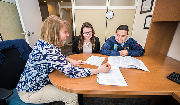 Sharon Tavernier advises two students.