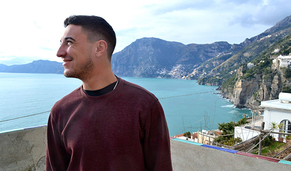 Nick Miale with Italy's Amalfi Coast in the background