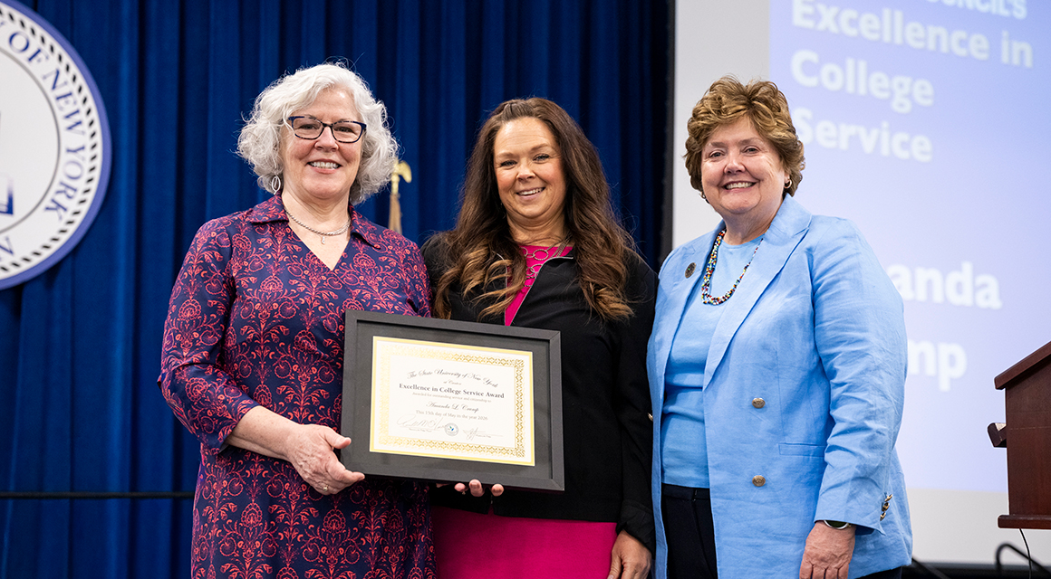 College Council members Kathy Dodge and Jenn Stevenson award Amanda Crump.