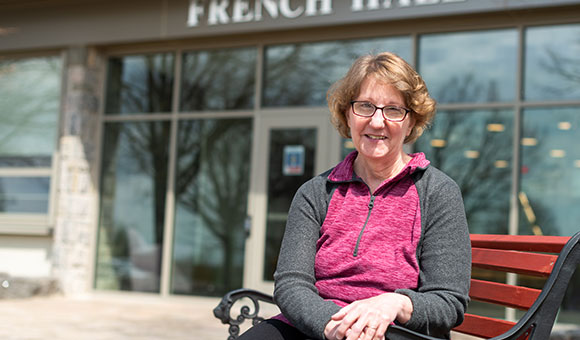 Amber Riordan sits outside French Hall.