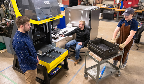 Three students work in the Asphalt Lab.