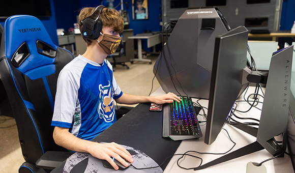New SUNY Canton Esports member Austin Kubo plays a game in the college’s state of the art Esports Arena.