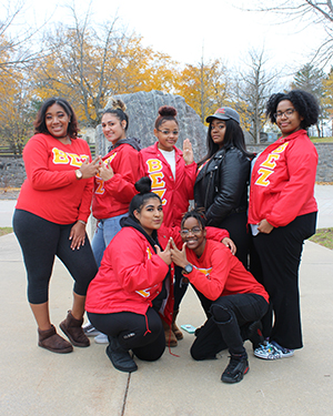 BEZ Sorority poses in front of the Campus Plaza rock.