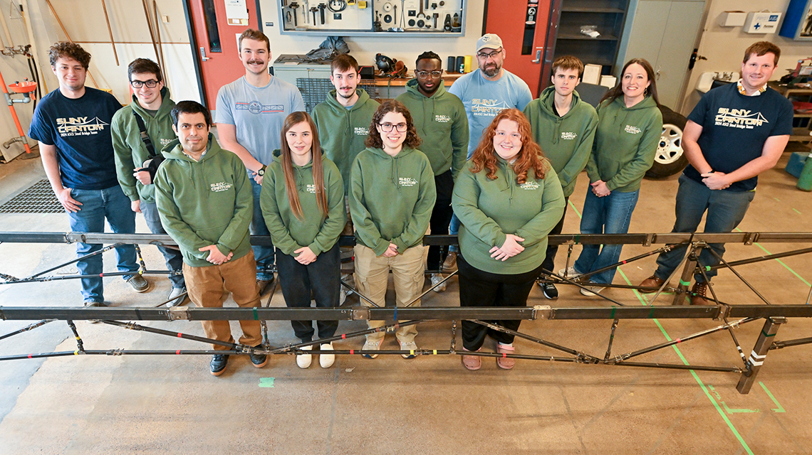 The 2026 Steel Bridge Team with their bridge.
