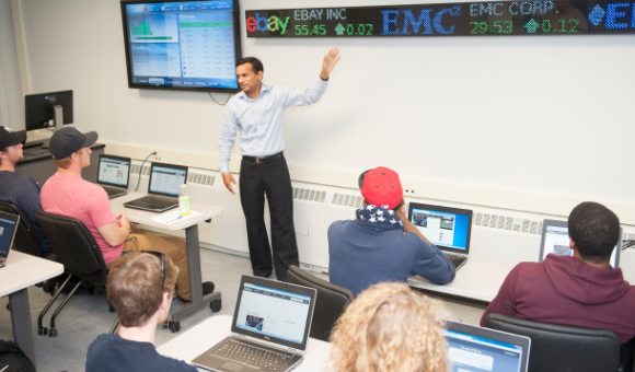 Umesh Kumar teaches class in the Financial Literacy Center