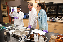 Students testing water samples with Adrienne Rygel.