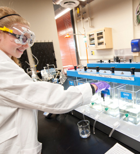 A student tests water samples in the Water Filtration lab.