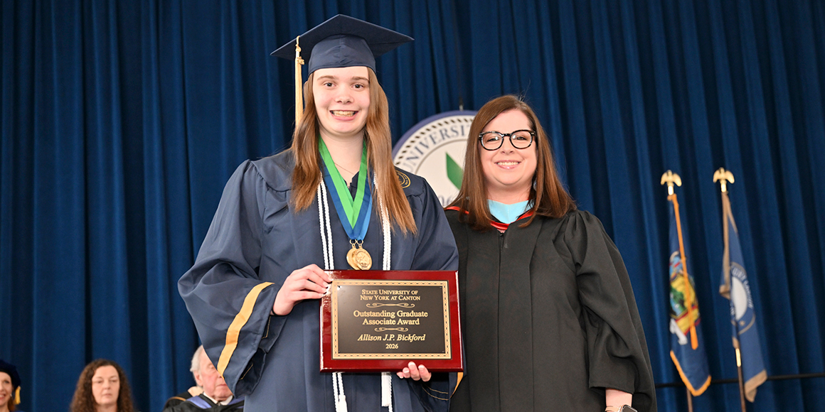 Allison Bickford poses with Vice President Courtney Bish after receiving the Outstanding Associate Graduate Award.