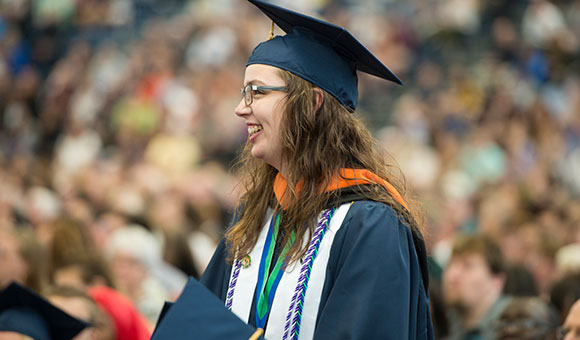Ashley Livingston stands among the students and guests at Commencement