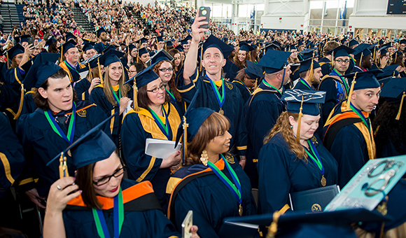 Graduates celebrate in Roos House