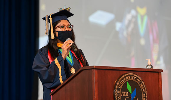 Sidei Clouden gives a speech during the Commencement 2021 ceremony.