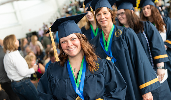 Students enter Roos House during the 2022 Commencement Ceremony.