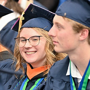 Madeline Derouchie is all smiles after crossing the Commencement stage.