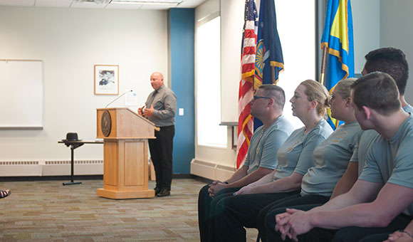 Rodney Votra addresses guests at the Corrections Academy graduation