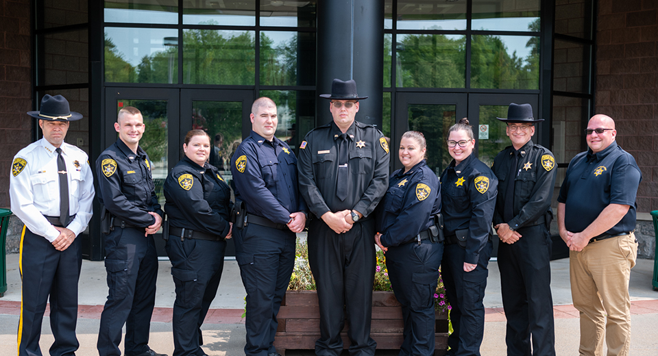 Corrections Academy Class of 2021 stand in front of Miller Campus Center.