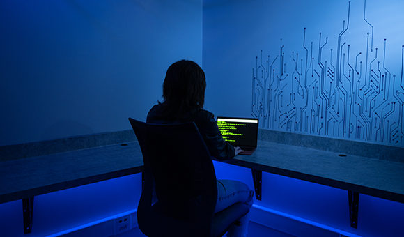 A student works in the Cybersecurity Wi-Fi Ethical Hacking Lab.