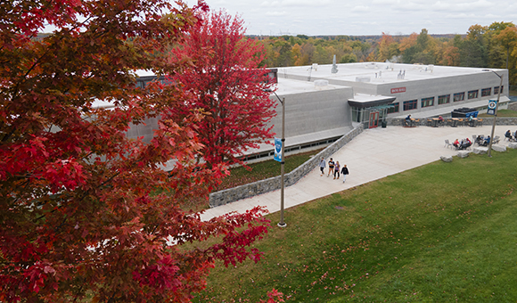 Aerial view of Dana Hall on an autumn day.