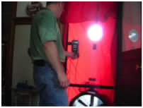 A person conducts a door test for energy efficiency.