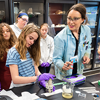 High school students work with Professor Rygel.