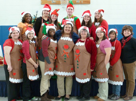 Students pose in holiday outfits.