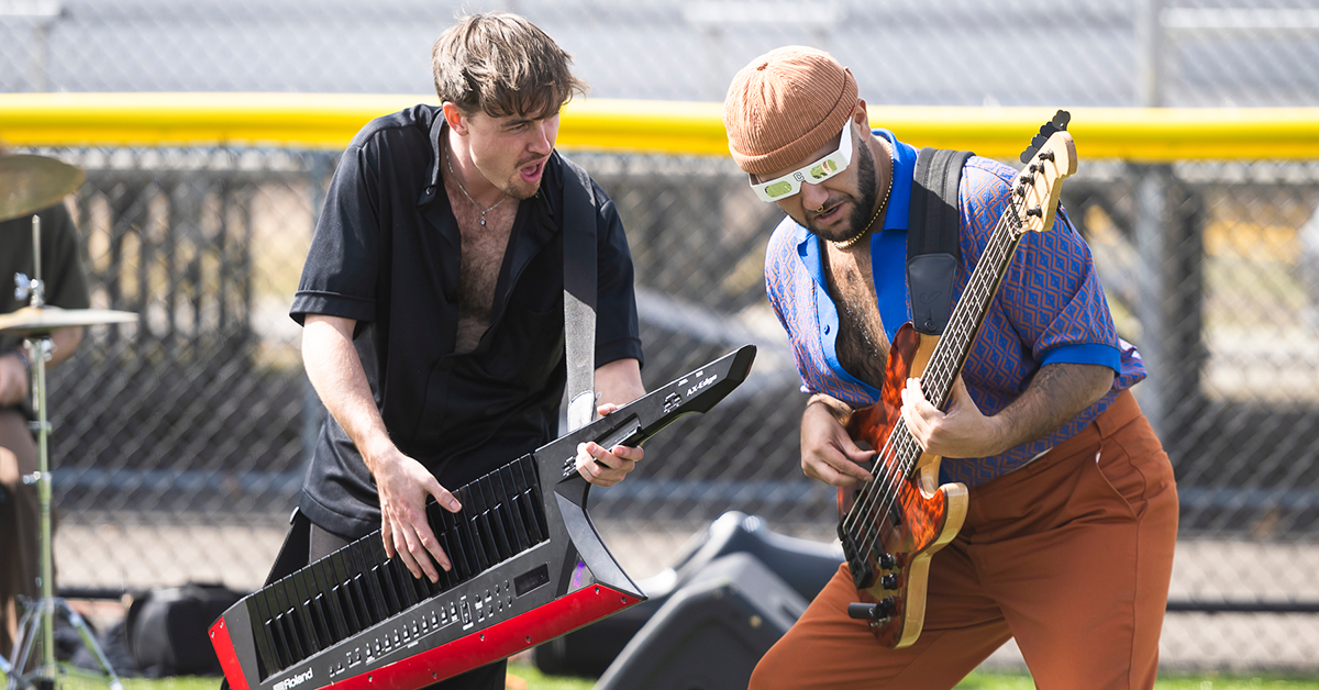 The keytar and bass player from the funk band Free Label jam during the Rooclipse celebration.
