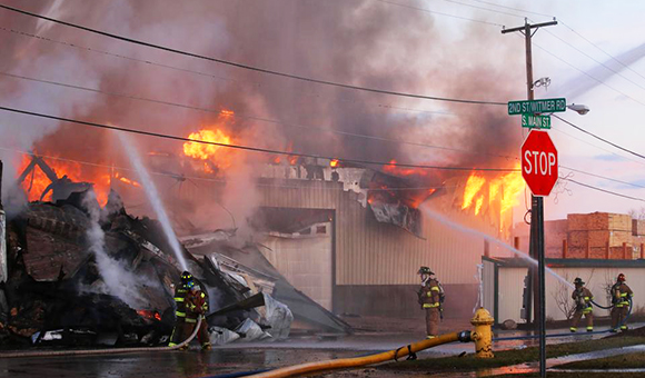 Firefighters battle a warehouse blaze