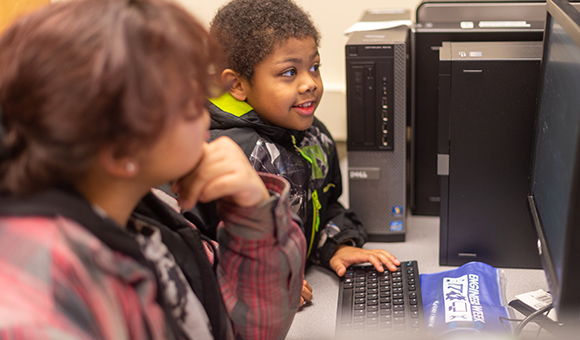 A student types on a computer during Engineer's Week.