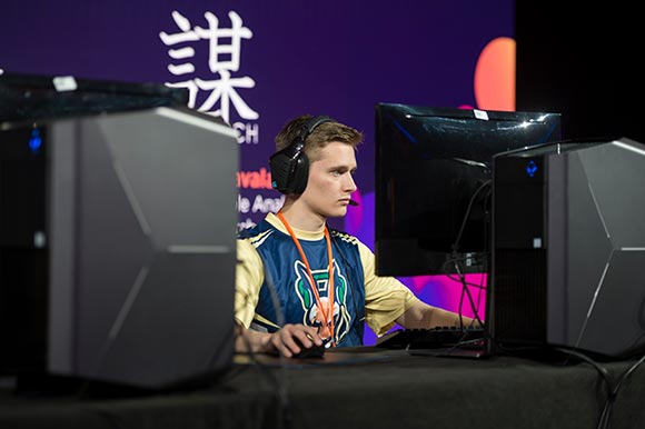 A student games at an Esports tournament.