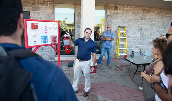 Derek Converse delivers fire prevention training outside Southworth Library.