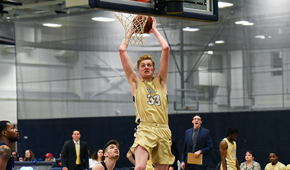 SUNY Canton's Andrew Fitch goes up for a slam dunk.