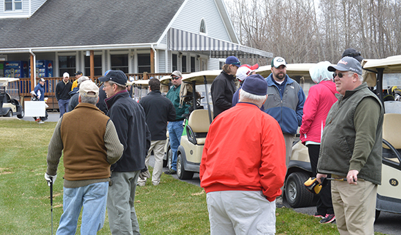 Golfer get ready to tee-off.