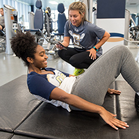 Students doing sit-ups.