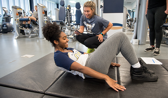Students work on core strength development in the Fitness Center.