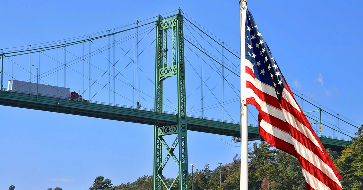 An American flag fies in front of the Thousand Islands bridge.