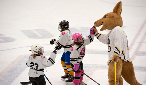 Roody slapping five with a young hockey player