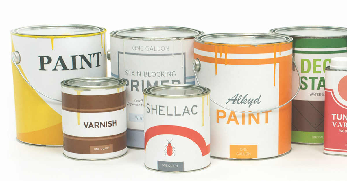 Paint and varnish cans lined up.