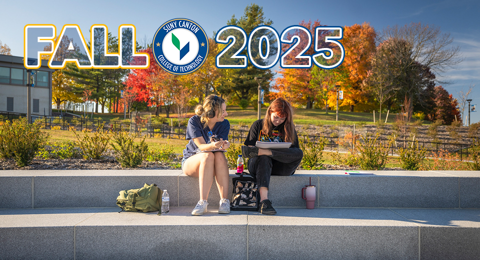 Fall 2025 - Two students sitting on the steps near French Hall on a beautiful fall day.