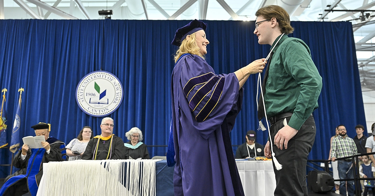 Dean Michele Snyder awards a student in the School of Science, Health, and Criminal Justice at Honors Convocation.