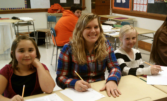 St. Lawrence student assisting with homework